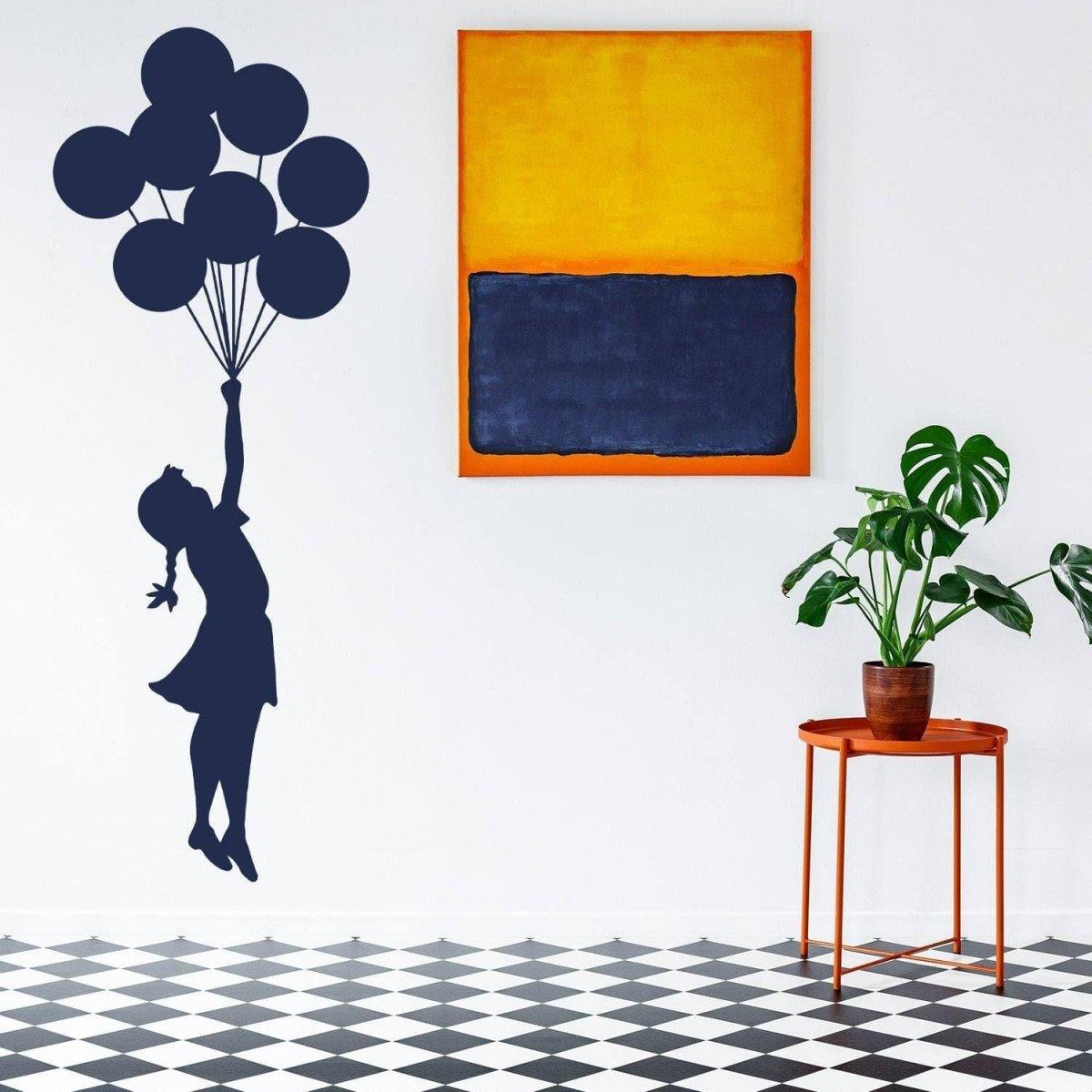 Ethereal Dreams Balloon Girl Wall Sticker in modern nursery with art and plants.