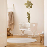 Ethereal Dreams removable wall sticker featuring a girl holding balloons in a cozy nursery setting.