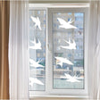 Bird safety window decals by FeatherGuard displayed on a window, enhancing home aesthetics and protecting wildlife.