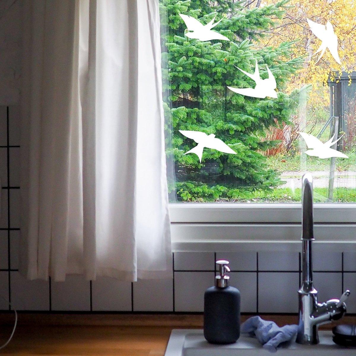 FeatherGuard window decals featuring frosted bird silhouettes for bird-safe homes.