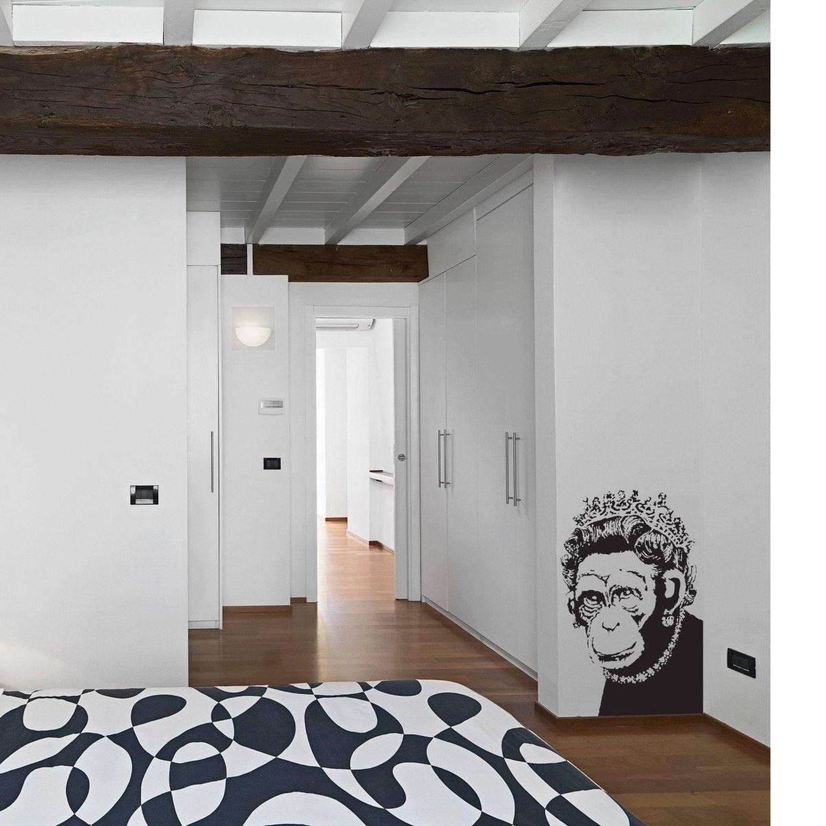 Queen Monkey Vinyl Wall Art Decal in a stylish bedroom with modern decor and wooden beams.
