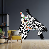 Vinyl decal of a giraffe wearing headphones, colorful wall art design in a modern room setting.