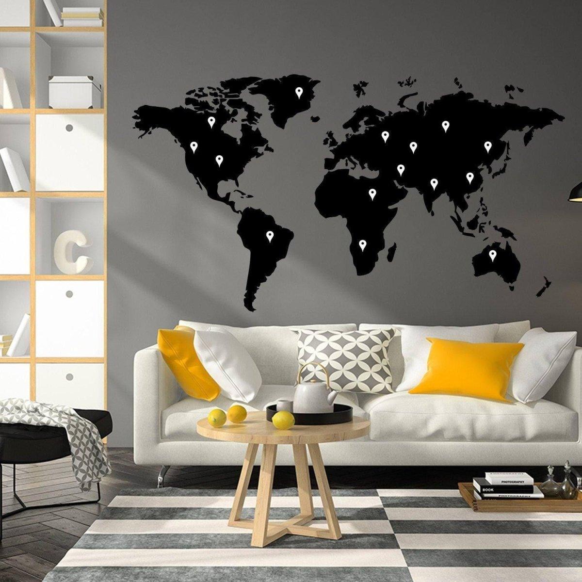 Artistic world map vinyl sticker on wall above modern sofa.