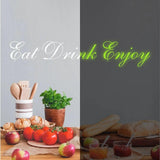 Наклейка Eat Drink Enjoy рядом с кухонными продуктами