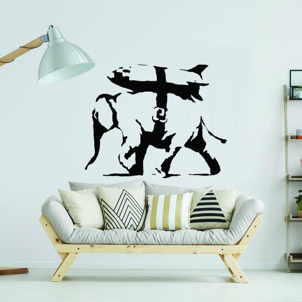 Graffiti-style elephant wall decal displayed above a modern sofa.