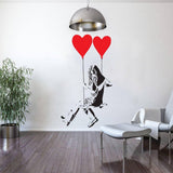 Vinyl heart balloon wall decal featuring a girl swinging with red heart balloons.