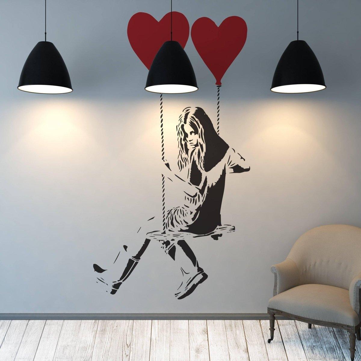 Vinyl heart balloon wall decal featuring a girl on a swing, creative home decoration, stylish interior design.
