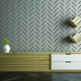 Herringbone peel and stick wall stickers in a modern living room with geometric design and stylish decor.