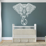 Elephant head wall vinyl sticker over a crib, showcasing Aztec geometric design in a nursery.