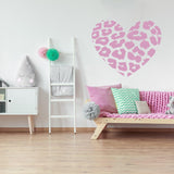 Leopard heart wall sticker in a stylish room with pink decor and cozy seating.