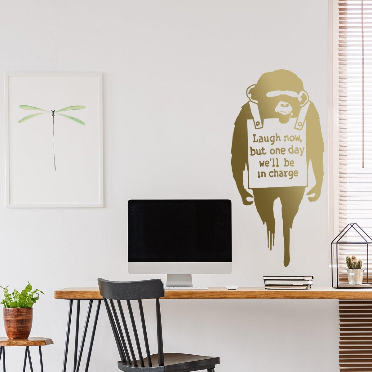 Monkey wall sticker holding a Laugh Now quote sign.