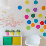 Bird with grenade wall sticker in a colorful modern room with plants.