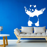 Panda with pistols wall sticker displayed on a blue wall.