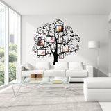 Vinyl wall decal of a tree displaying family photos in frames.