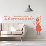Girl anarchist wall sticker with a smiley-face sign in a living room.