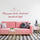 Rule For A Lady wall sticker above a pink couch, inspiring female empowerment with stylish font design.