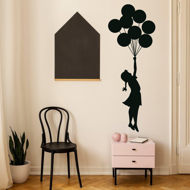 Balloon girl wall sticker displayed in a nursery.