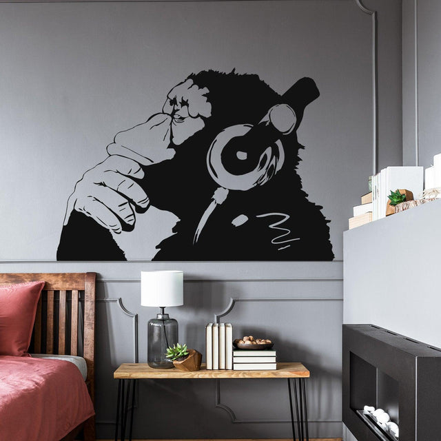 Thinking monkey wall sticker with headphones in a modern bedroom.