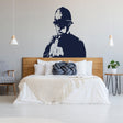 Street art policeman middle-finger wall decal displayed in a stylish bedroom.