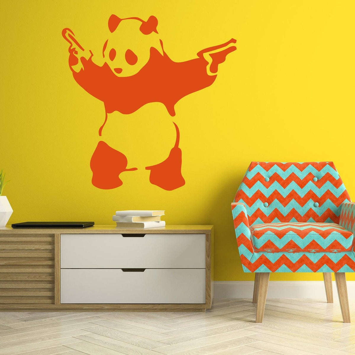 Panda with pistols wall sticker on a yellow wall.