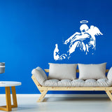 Fallen angel street art wall sticker on a blue wall.