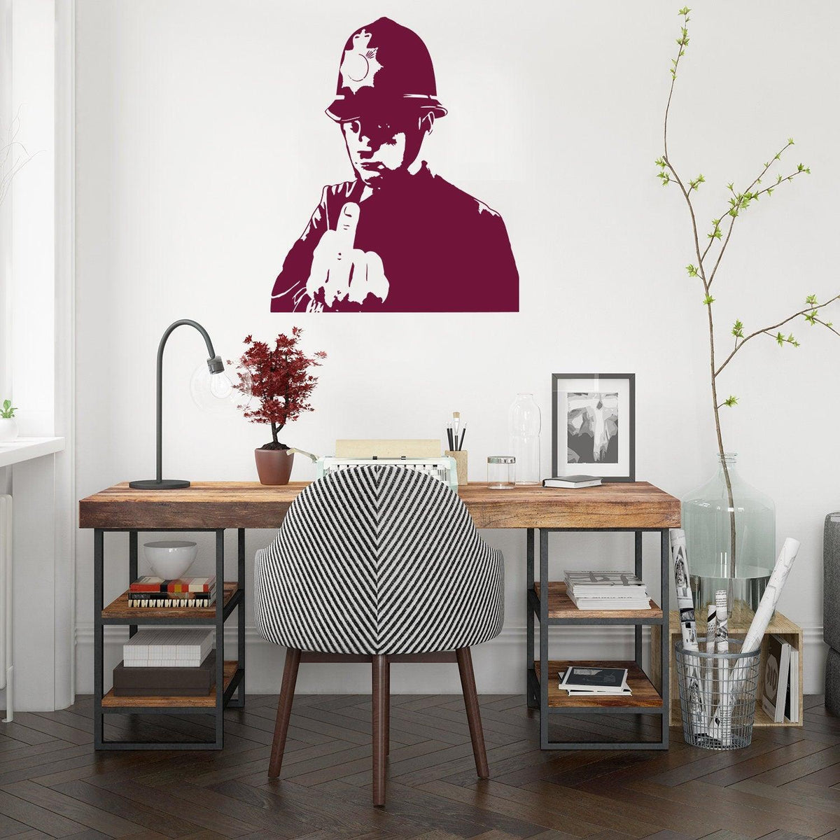 Policeman middle-finger wall decal displayed in a modern workspace.