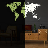 Glow in dark world map vinyl sticker displayed on a wall, showcasing a unique night glowing effect.