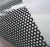 Close-up of custom one way window film showing dot pattern for privacy and light filtration.