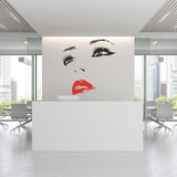 Elegant woman face vinyl sticker on white wall, modern decor with red lips.