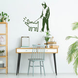 Person walking a dog wall sticker displayed in a stylish room.