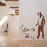 Person walking a dog street art vinyl wall sticker.