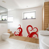 Red octopus tentacles vinyl wall art sticker in modern bathroom decor, adding an oceanic touch to the space.