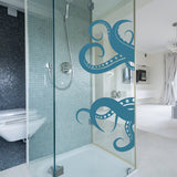 Octopus tentacles vinyl wall art sticker in modern shower, adding ocean decor to a stylish bathroom.