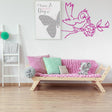 Bird with grenade street art wall sticker in a modern living room with pink decor.