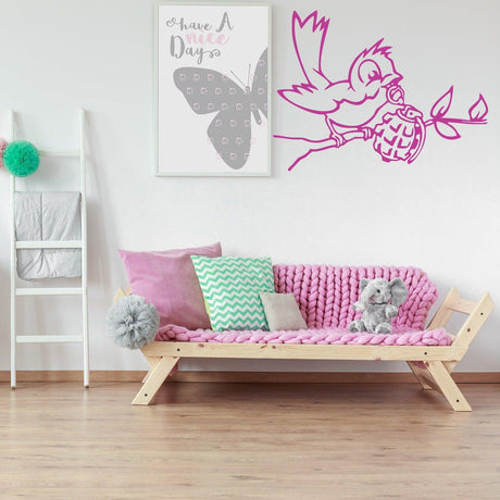 Bird with grenade street art wall sticker in a modern living room with pink decor.