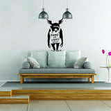 Keep It Real monkey wall decal above a sofa in a modern living room.