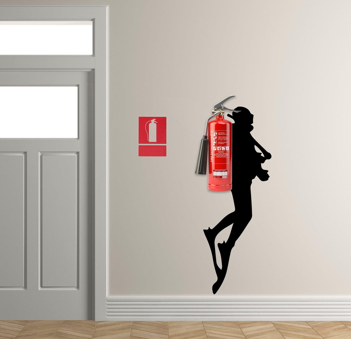 Scuba Diver wall sticker silhouette next to a fire extinguisher in a modern interior setting.