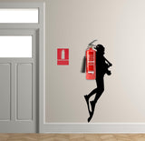 Scuba Diver wall sticker silhouette next to a fire extinguisher in a modern interior setting.