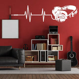 Headphone vinyl wall sticker on red wall, featuring heartbeat line design.