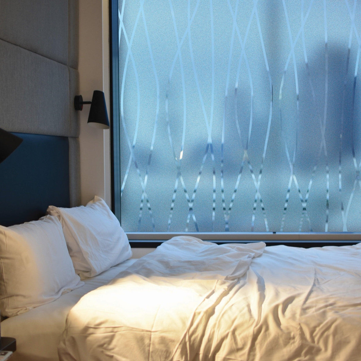 Frosted glass window vinyl sticker designed for privacy and elegance in a modern bedroom setting.