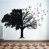 Elegant tree wall decal with intricate branches and birds.