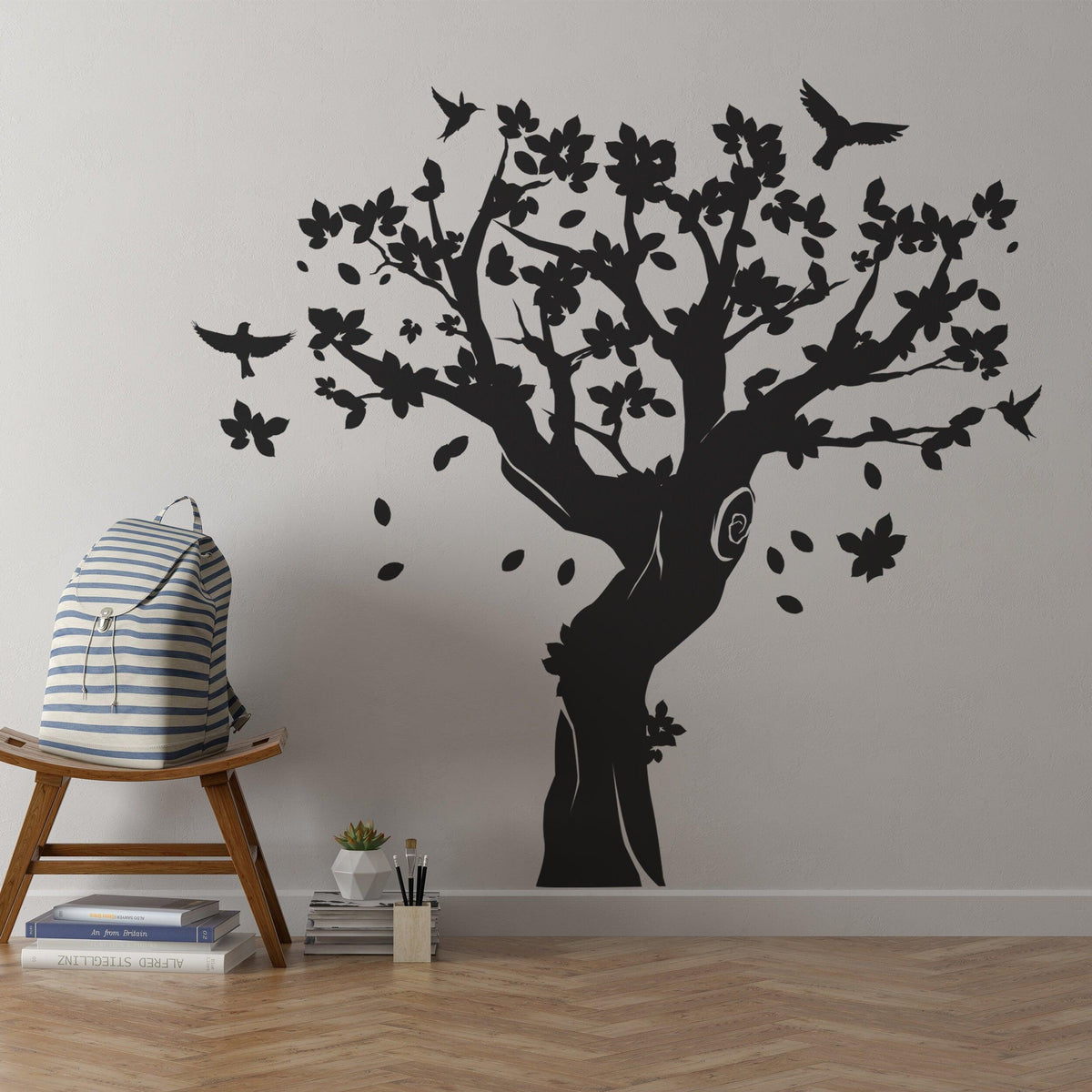 Large black tree wall decal with birds and flowers in kids room.