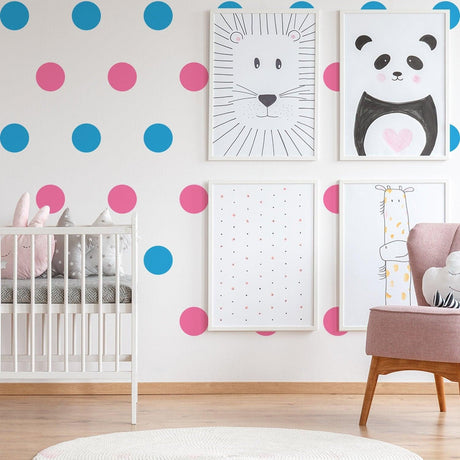 Colorful vinyl wall decals in a kids nursery with blue and pink dots, featuring cute animal art and a cozy crib.