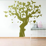 Large tree wall decal with birds for kids nursery, adding charm and whimsy to the room.
