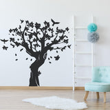 Tree wall decal decor in black, featuring intricate branches and flowers.