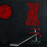 Vinyl wall decal of a muscular figure with the text 'Train Like A Beast' in a gym setting.