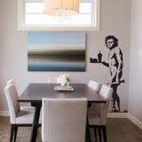 Caveman wall decal displayed above a sofa.