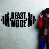 Fitness gym wall decal with 'Beast Mode' lettering, showcasing motivational workout decor.