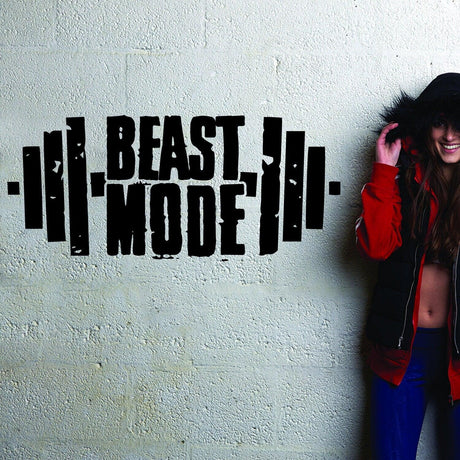 Fitness gym wall decal with 'Beast Mode' lettering, showcasing motivational workout decor.