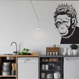 Monkey queen wall sticker displayed in a modern kitchen.